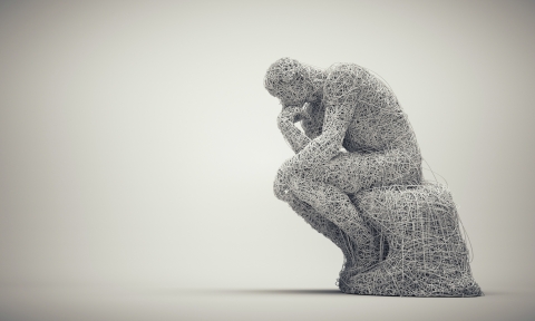 Thoughtful man sitting down. Confusion and overthinking concept.