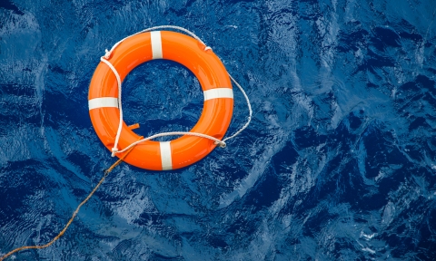 Grado de Socorrismo Safety equipment, Life buoy or rescue buoy floating on sea to rescue people from drowning man.