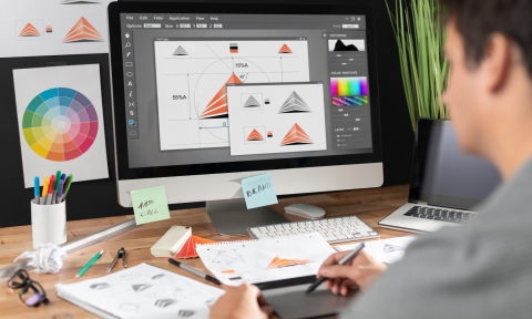 Graphic designer drawing sketches logo design.